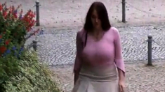 Busty girl walking, no bra, jiggling